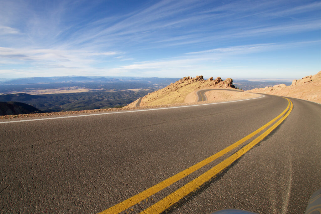 Speedometer on a Colorado highway illustrating speeding versus reckless driving penalties under SB 26-035